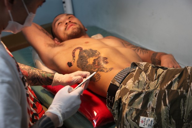 that he's a traditional Japanese tattoo artist who practices the art of