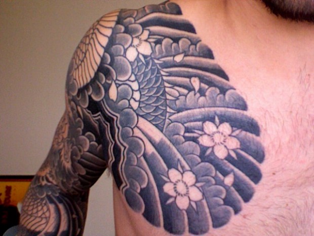 black and gray tattoo. The scales lack and gray… but